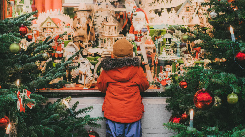 Child looking at Rothenburg Christmas display