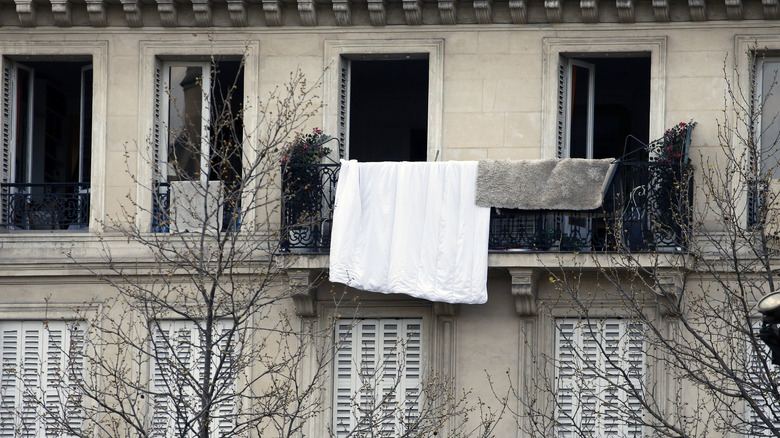 Laundry hanging outside of a building in Paris