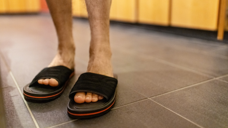 Close-up of swimmer wearing slippers