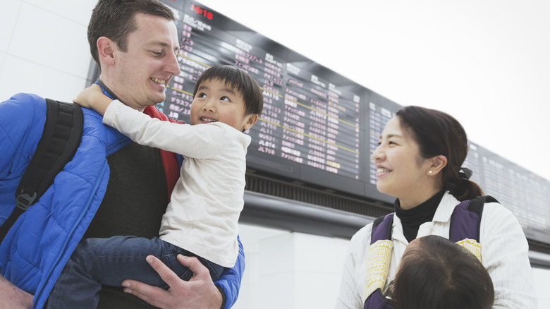 smiling family at airport