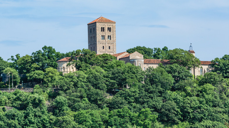 trees, stone tower and building, sky