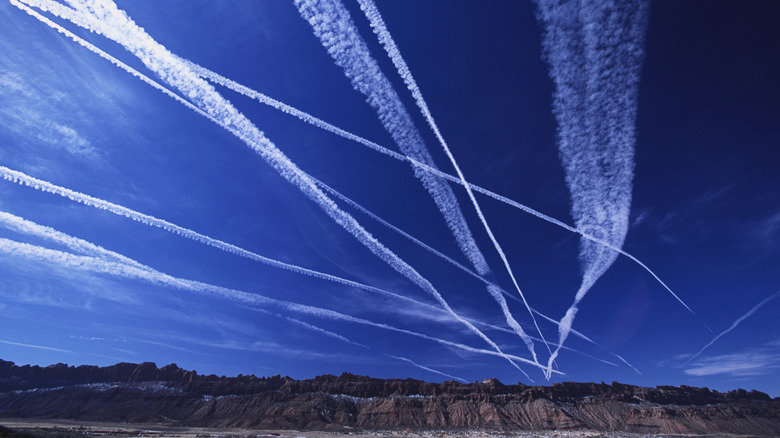 contrails streaking the sky