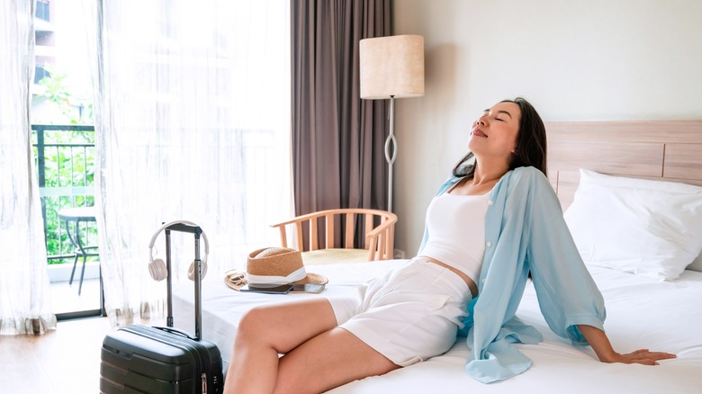 woman relaxing in hotel room