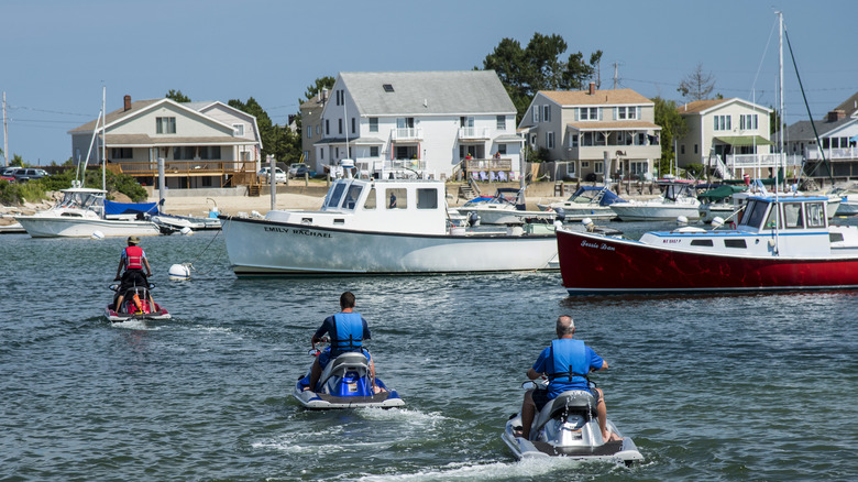 Jet-skiers and boats