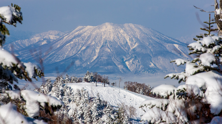 Ski lift at Shiga Kogen with mountains in the distance