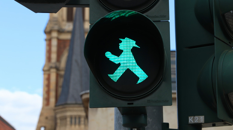 Green pedestrian crossing light in Germany