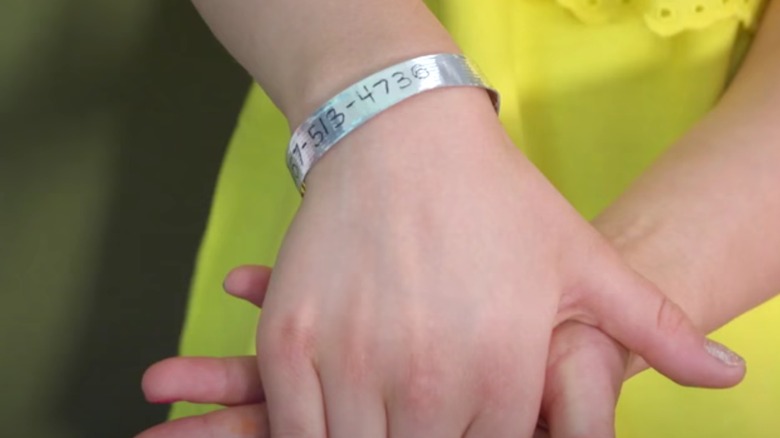 Silver phone ID bracelet on wrist