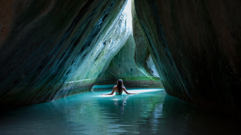 Female traveler exploring caves 