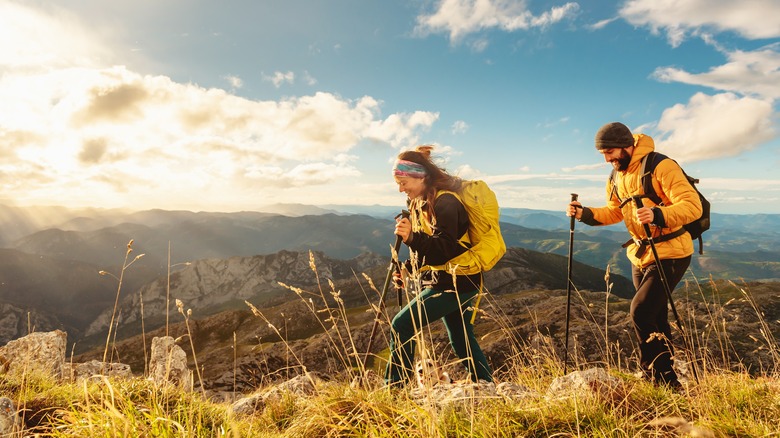 Hiking couple with trekking poles