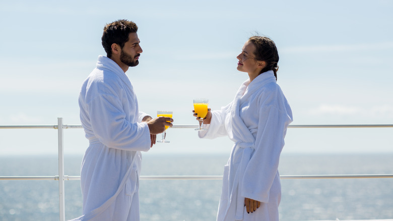 Couple wearing robes on cruise