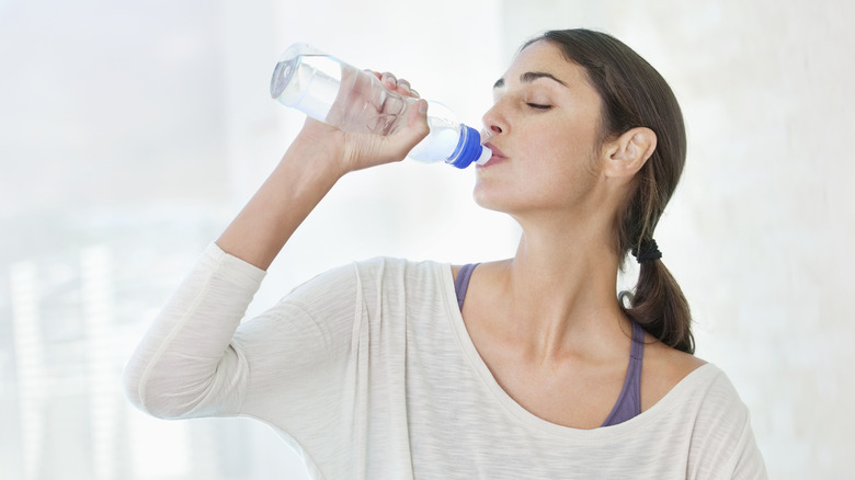 Woman drinking a bottle of water