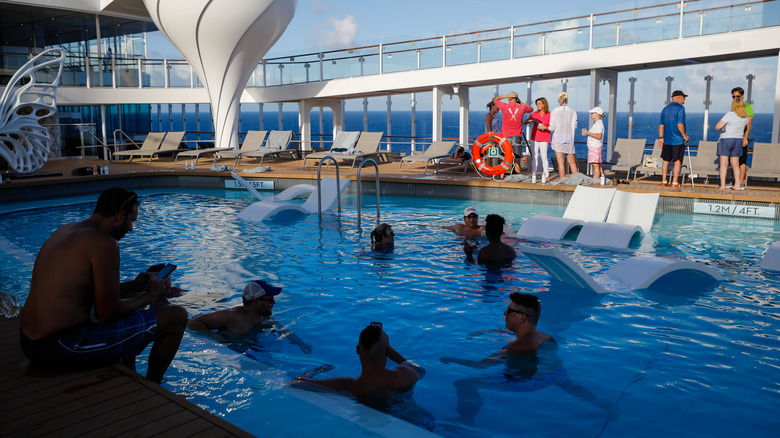 Passengers at cruise ship pool