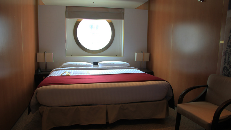 Standard cruise cabin with a queen bed and window