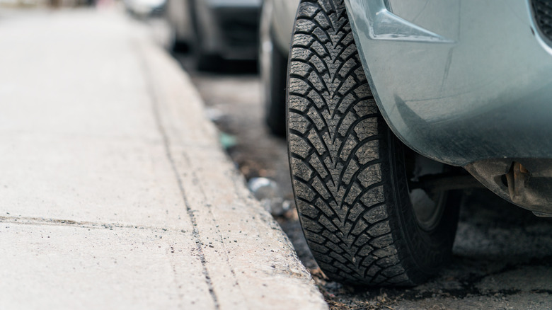 Car with curbed tires