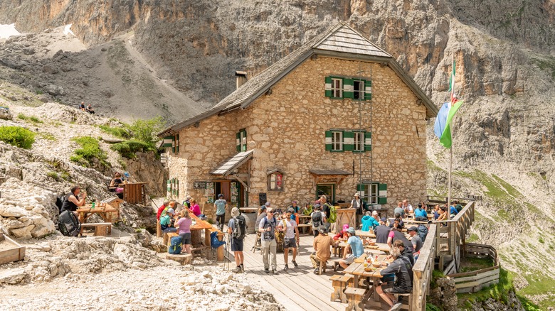 Hikers at mountain hut Italy