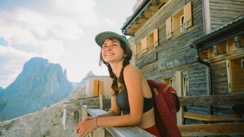 Woman hiker mountain hut Dolomites