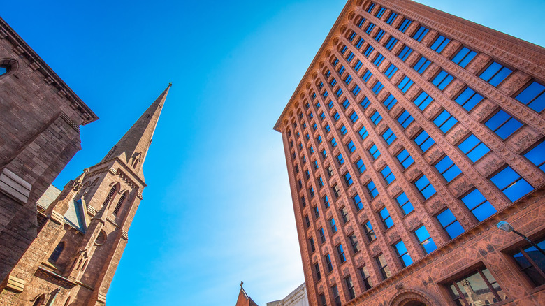 sandstone skyscraper opposite church