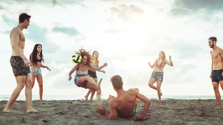 Beachgoers playing with a ball