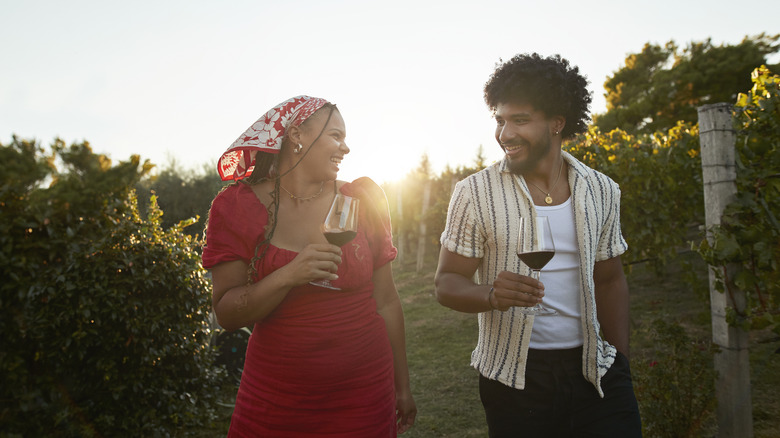 Couple walking in vineyard