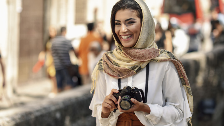 Photographer wearing a headscarf