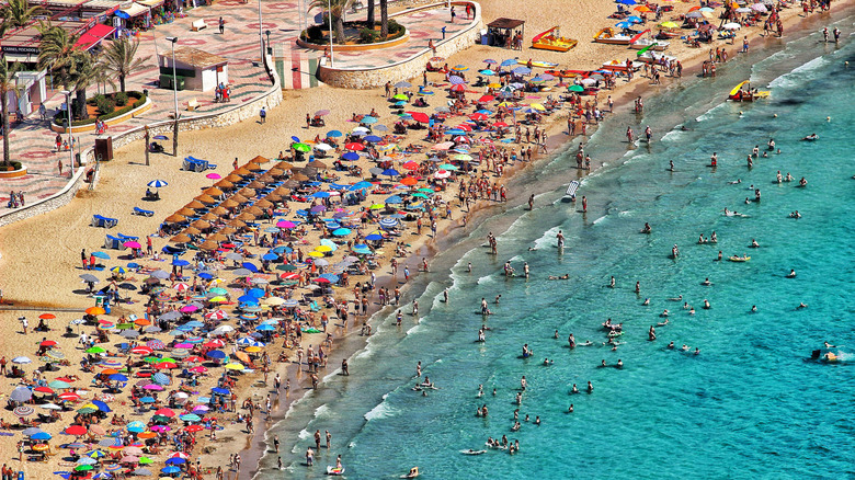 Aerial view crowded Spanish beach