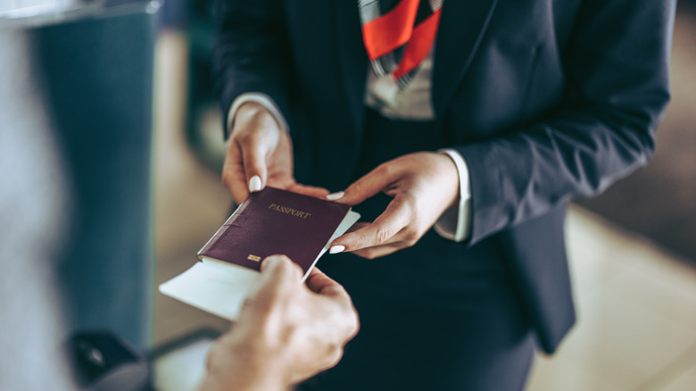 Person handing over passport