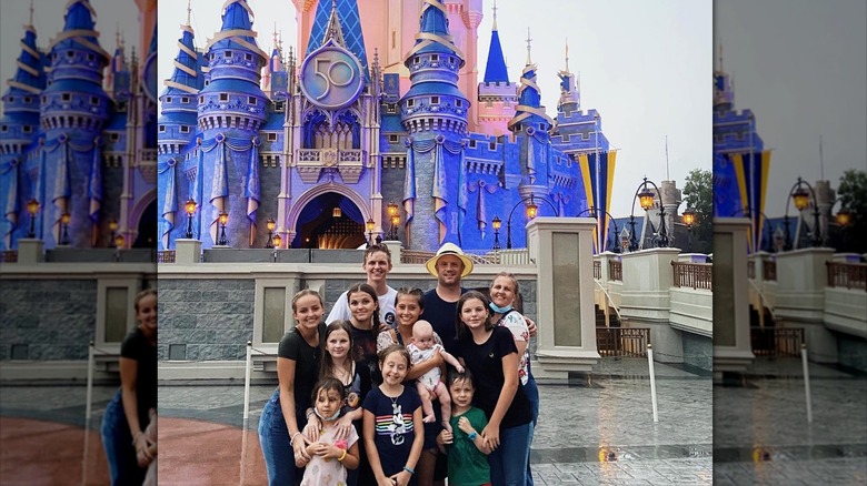 family in front of Cinderella castle 