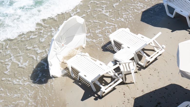 Loungers and umbrella after storm