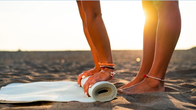 The Unexpected Purpose A Yoga Mat Serves On The Beach
