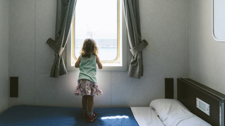 Child looking out cruise window