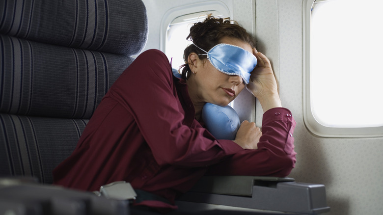 Woman sleeping during airplane flight