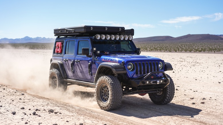 A Jeep crosses the desert