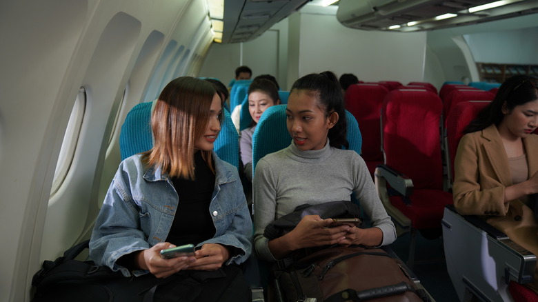 Passengers sitting in airplane