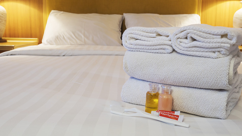 toiletries on hotel bed