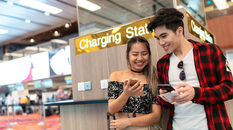 Couple at a charging station