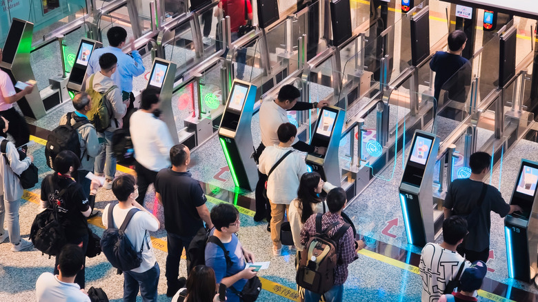 Travelers waiting at passport control