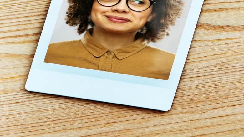 Printed photo of woman in glasses