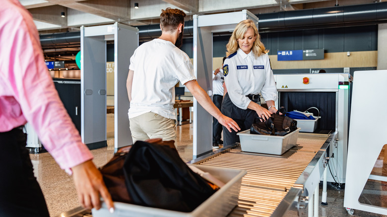 Travelers in line at security checkpoint