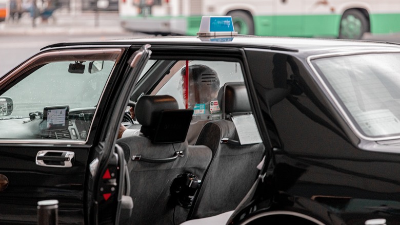 An open taxi door waiting for a customer in Japan