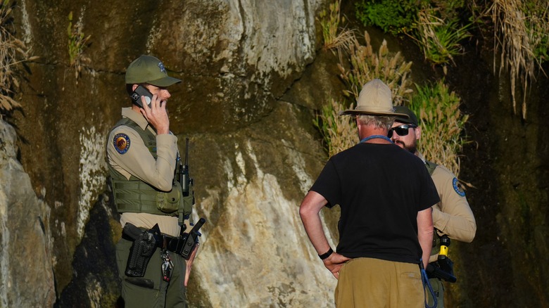 Park rangers talking to visitor