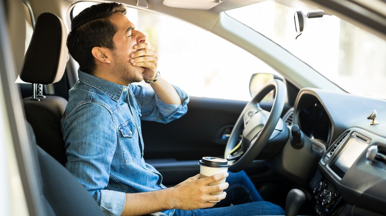 A sleepy man behind the wheel