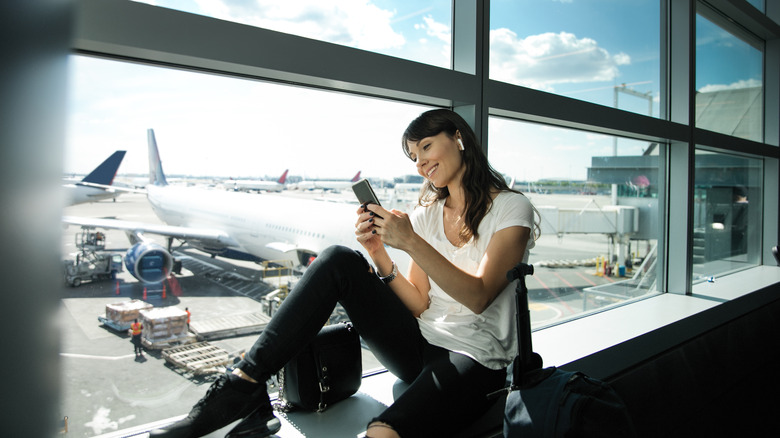 Woman waiting at the boarding area