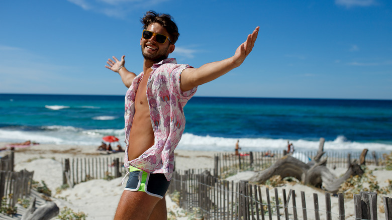 man posing on beach in france