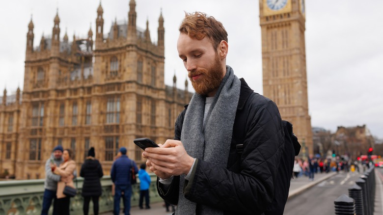 Man in London using smartphone