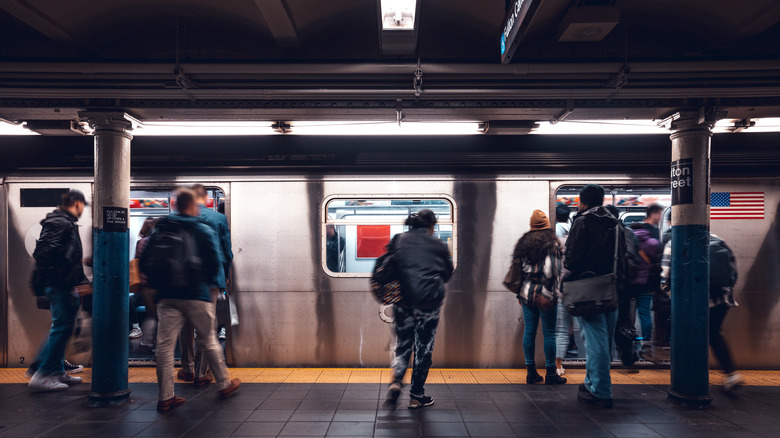 People getting on the subway in New York.