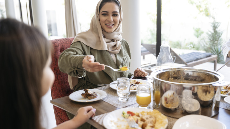 Two people sharing a meal together