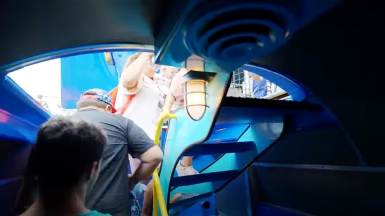 Guests climb stairs leaving Finding Nemo submarine