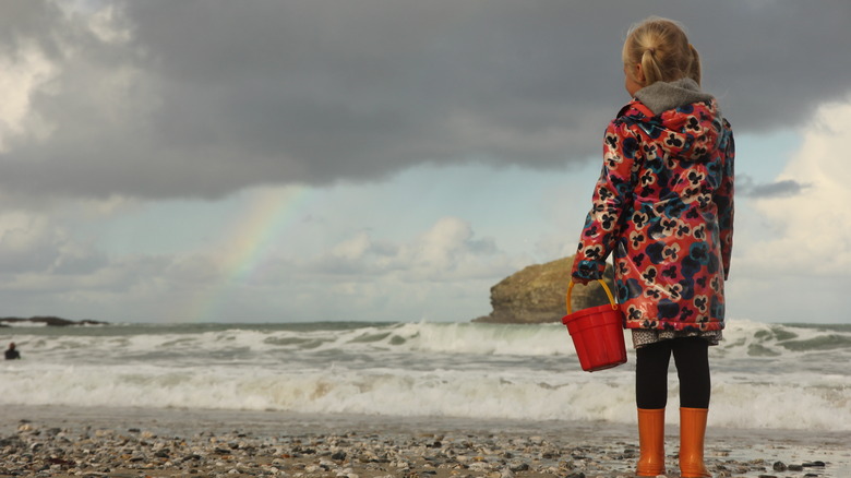 girl on rainy beach