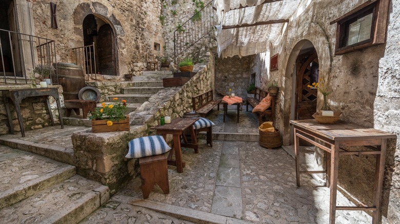 quaint courtyard with tables and benches