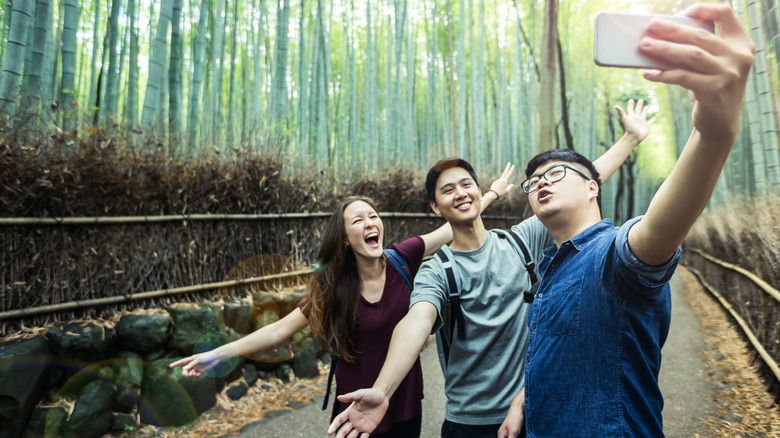 Tourists in Arashiyama Bamboo Forest